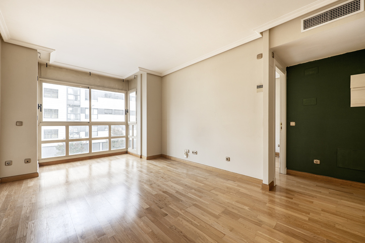 living-room-with-large-window-ducted-air-conditioning-and-oak-parquet-floors